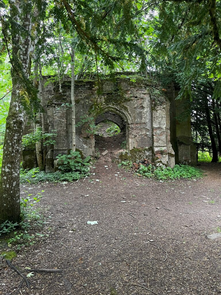 An old stone hut in the woods.