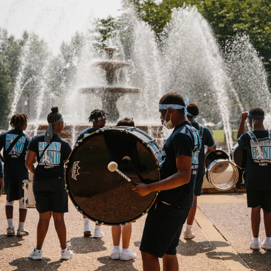 A high school marching band gathered around Wilson Park fountain during Handy Fest.