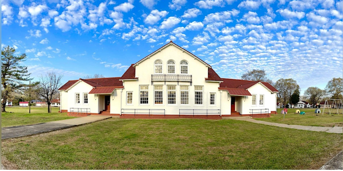 A white-brick school building.